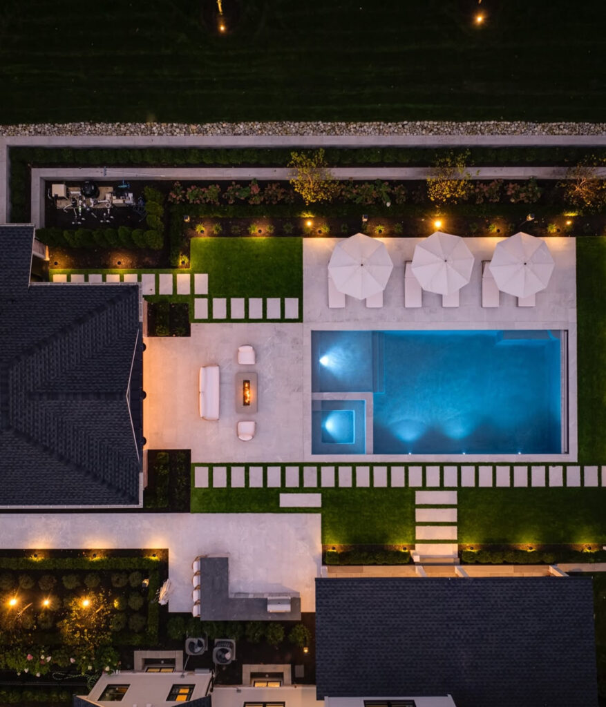 Aerial view of the Milton pool, spa, pool house, and outdoor kitchen