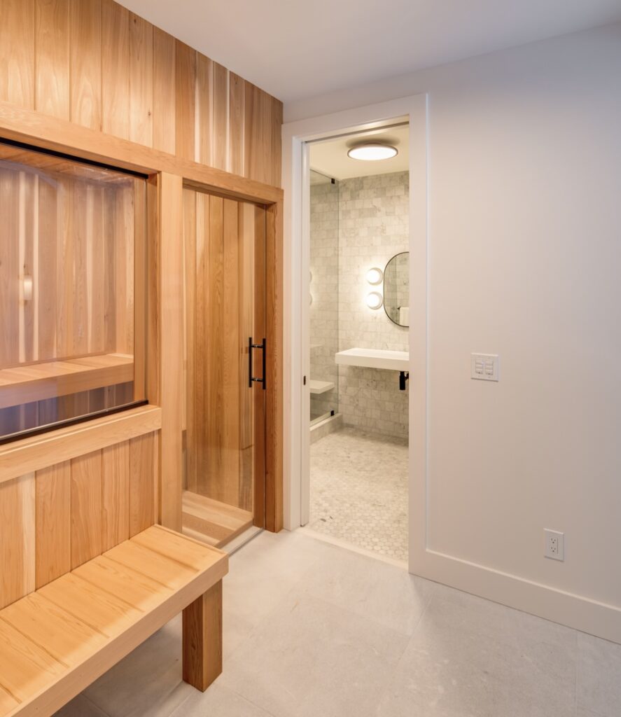 Cedar sauna beside a tiled shower