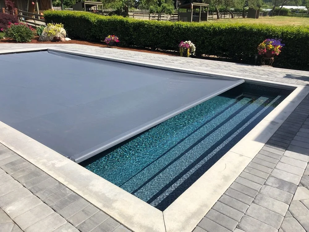 Coverstar automatic pool cover integrated with the pool deck