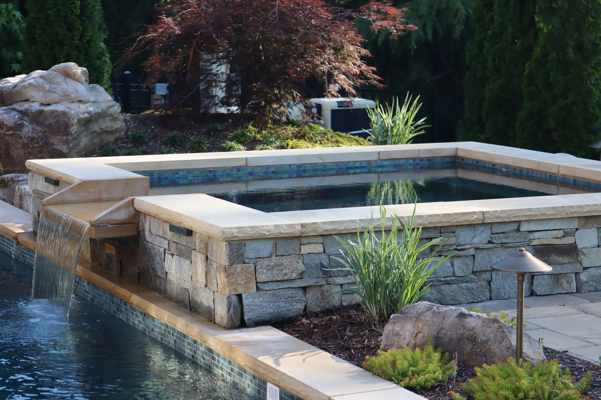 Fire bowls and water features in a Johns Creek pool design