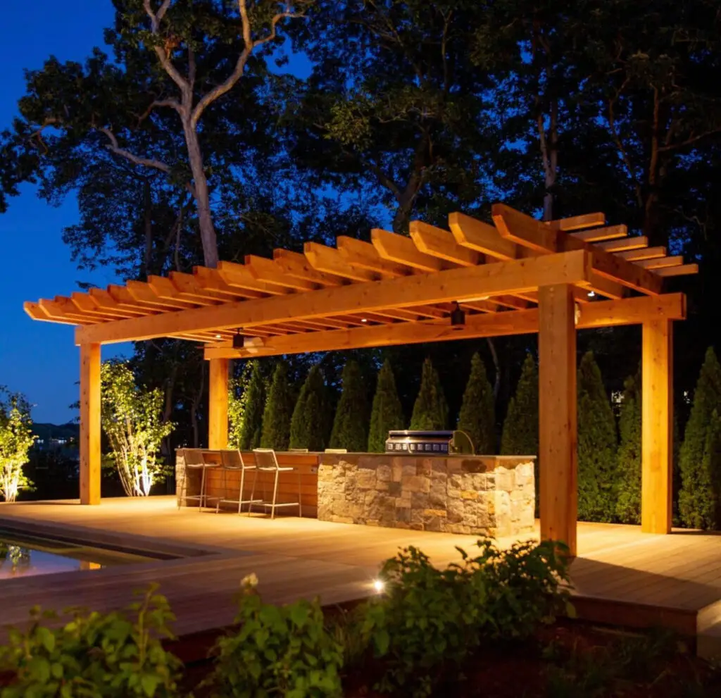 Pergola and outdoor kitchen overlooking a terraced pool
